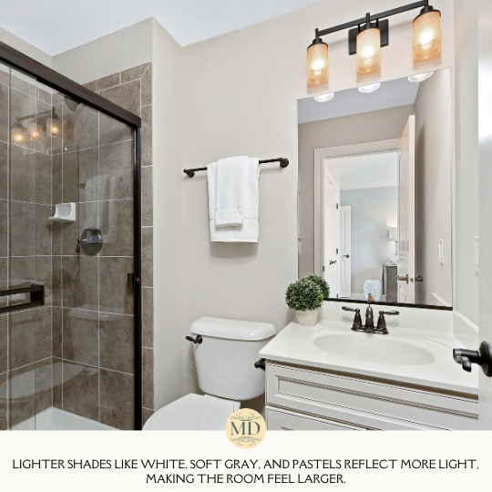 Lighter shades like white, soft gray, and pastels reflect more light, making the room feel larger.