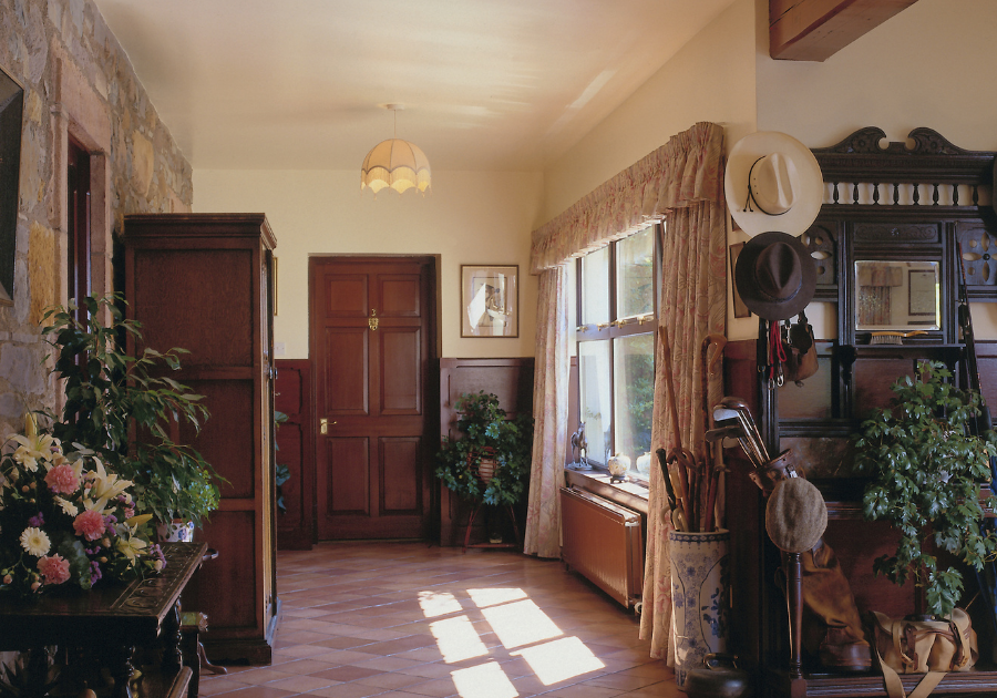 Best paint colors for original woodwork in a vintage home with warm cream walls and dark wood trim.