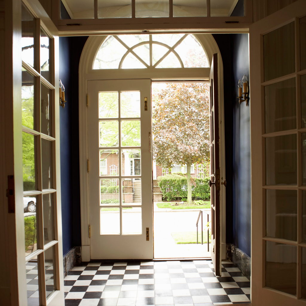 Welcoming entryway with original architectural details in an older home is one of the things buyers notice when viewing a house